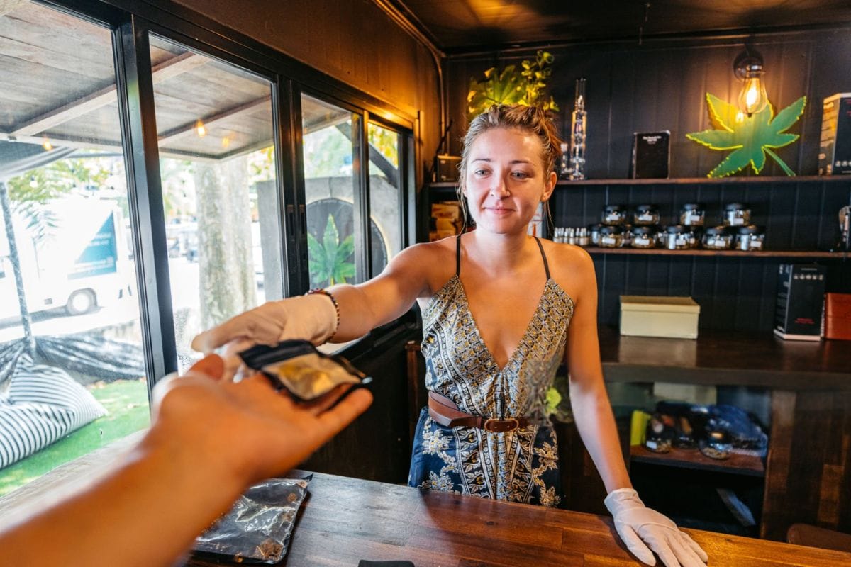 A lady is selling Delta 8 products in her dispensary
