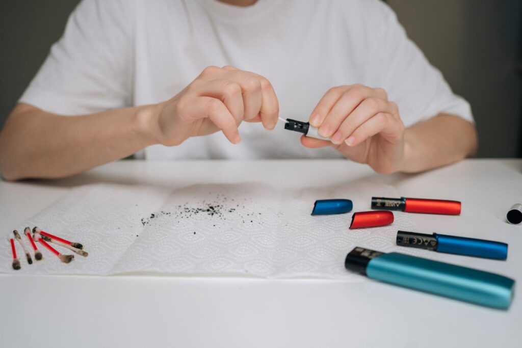 A person is cleaning a weed pen