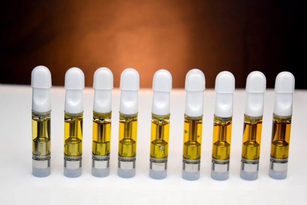 A collection of thca vape cartridges kept together